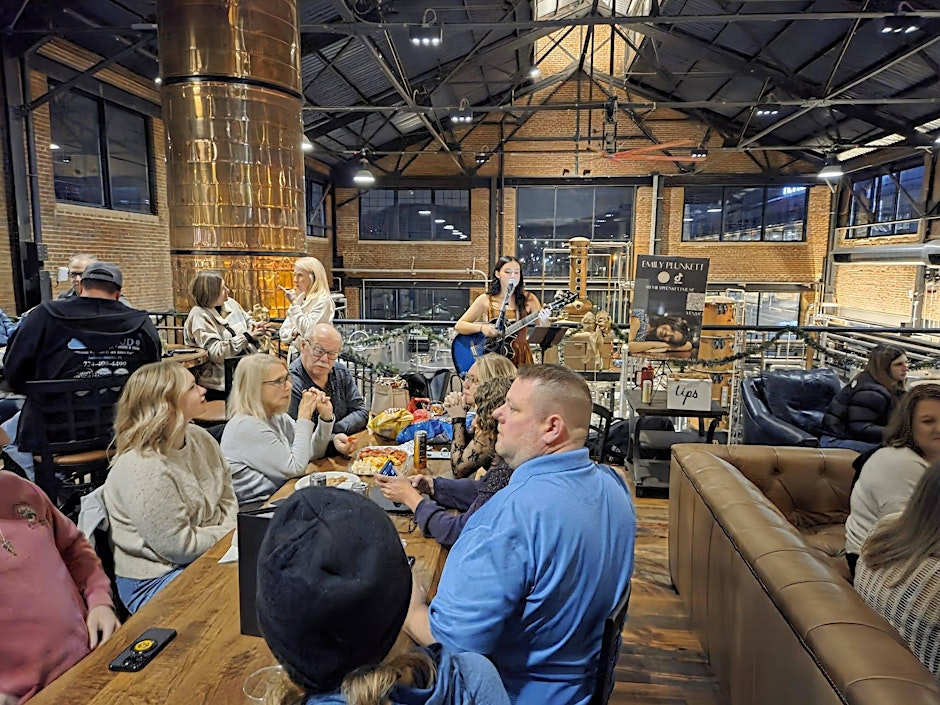 Emily Plunket performing on the Mezz at Iron City Distilling